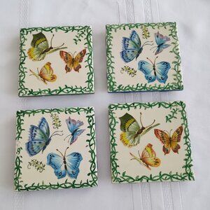 Four Coasters, two with Blue,  two with Green, Yellow and Orange Butterflies